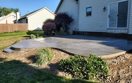 photo of a freshly finished concrete patio
